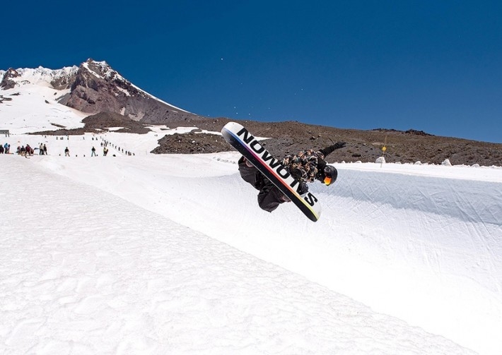 FREESTYLE SNOWBOARDER IN THE HALF PIPE AT TIMBERLINE