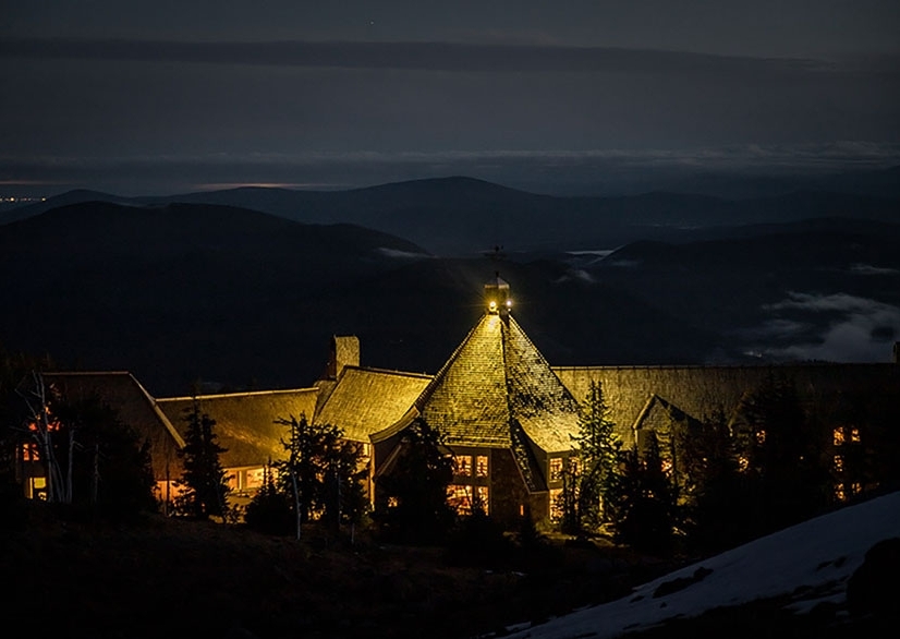 TIMBERLINE LODGE LIT UP AT NIGHT IN THE MIST