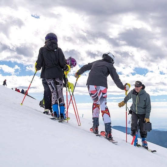 YOUTH PERFORMANCE SKIERS GETTING INSTRUCTION AT TIMBERLINE