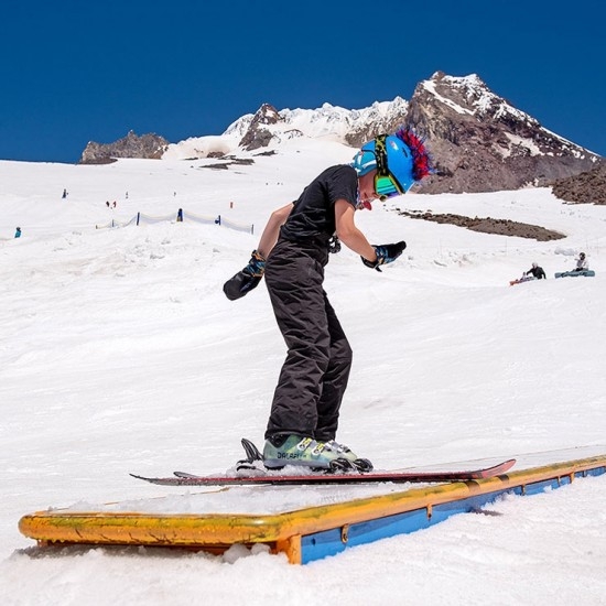 YOUTH FREESTYLE SKIER ON TABLE TOP FEATURE AT TIMBERLINE