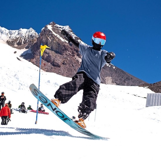 YOUTH FREESTYLE SNOWBOARDER AT TIMBERLINE