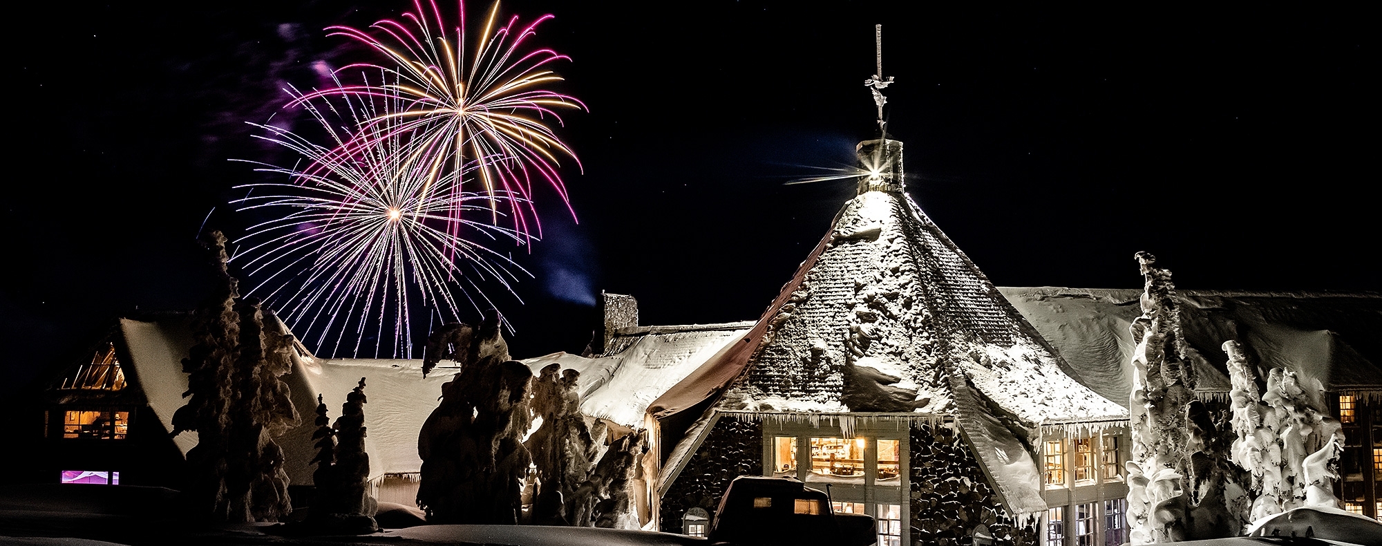 FIREWORKS EXPLODING OVER TIMBERLINE LODGE ON NYE