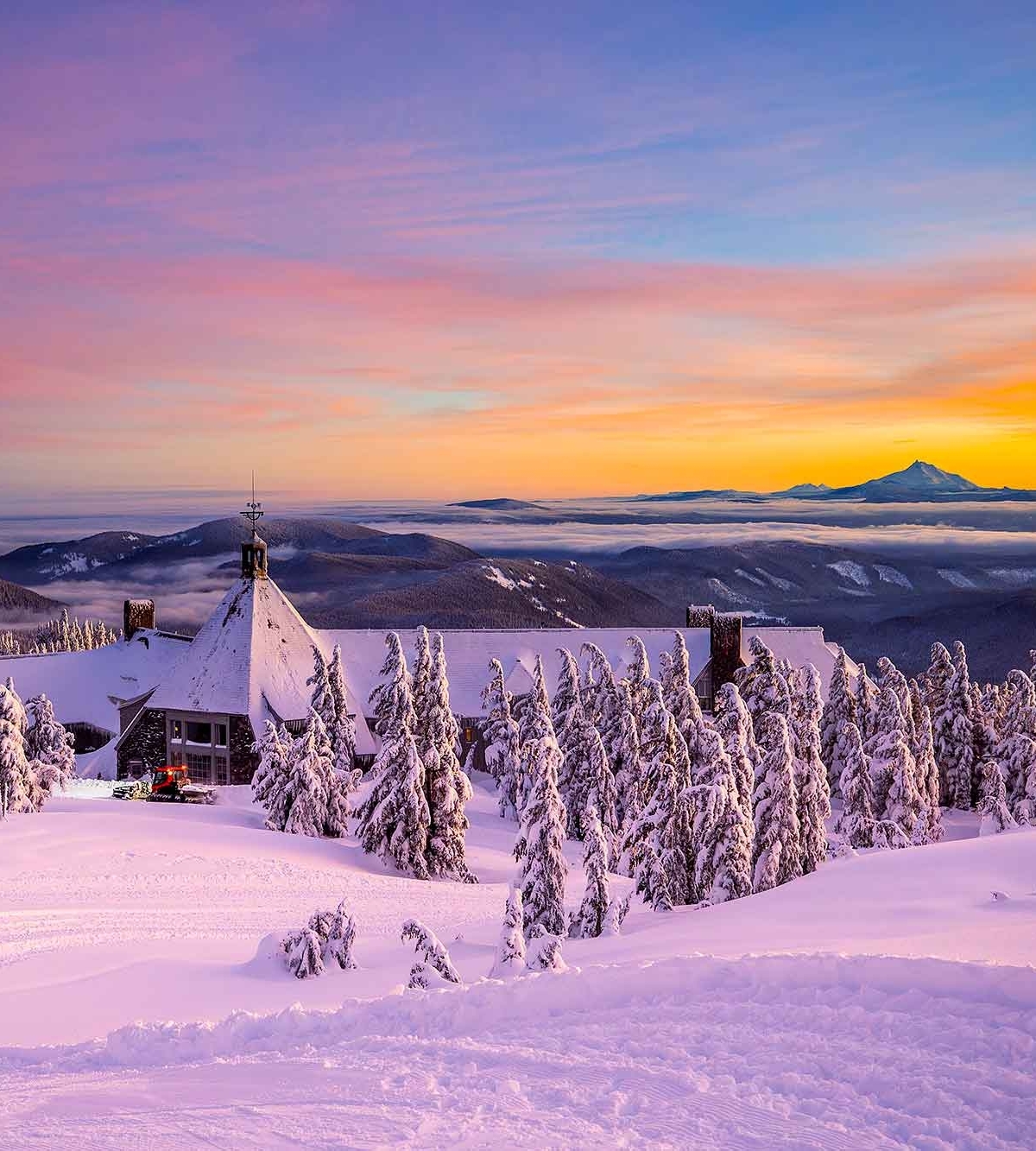 VIEW OF TIMBERLINE LODGE FROM THE REAR AT SUNSET 