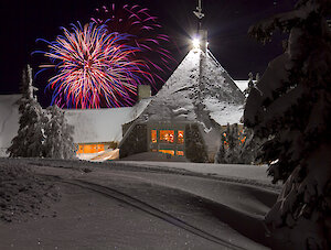 Fireworks going off over Timberline Lodge on New Year's Eve