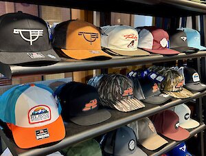 Wall of Timberline logo hats in the Wy'EAst Store