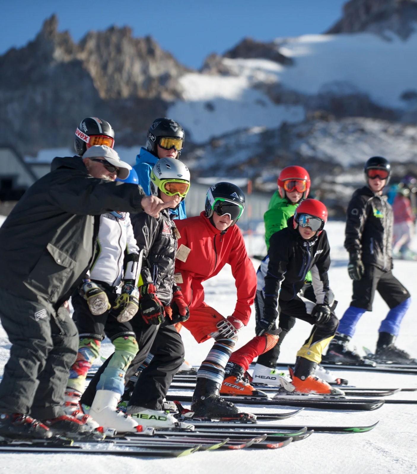 Tichy racing instructor with ski racers at Timberline on Mt. Hood