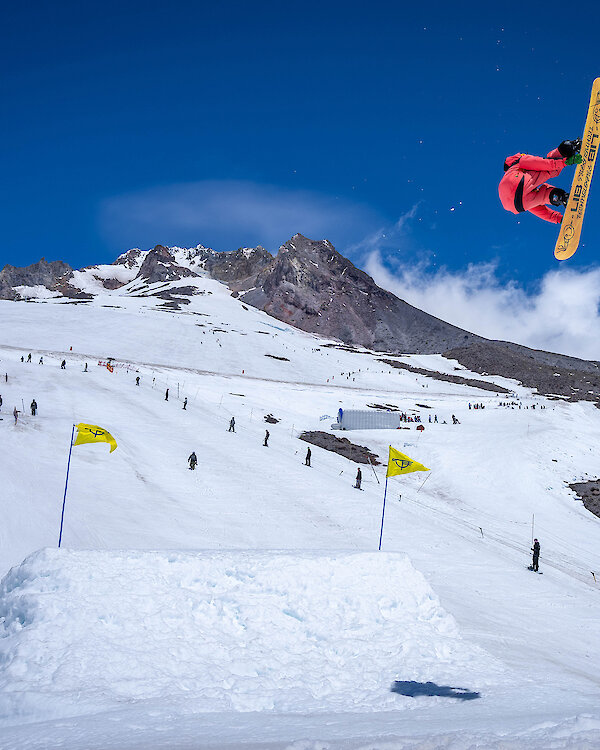 Snowboarder airs off a jump at the Timberline Freestyle Training Center on Mount Hood.