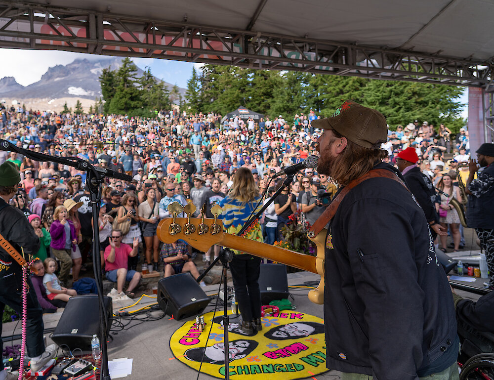 Timberline Daydream music festival view from the stage looking out onto a crowd of people and Mt. Hood.