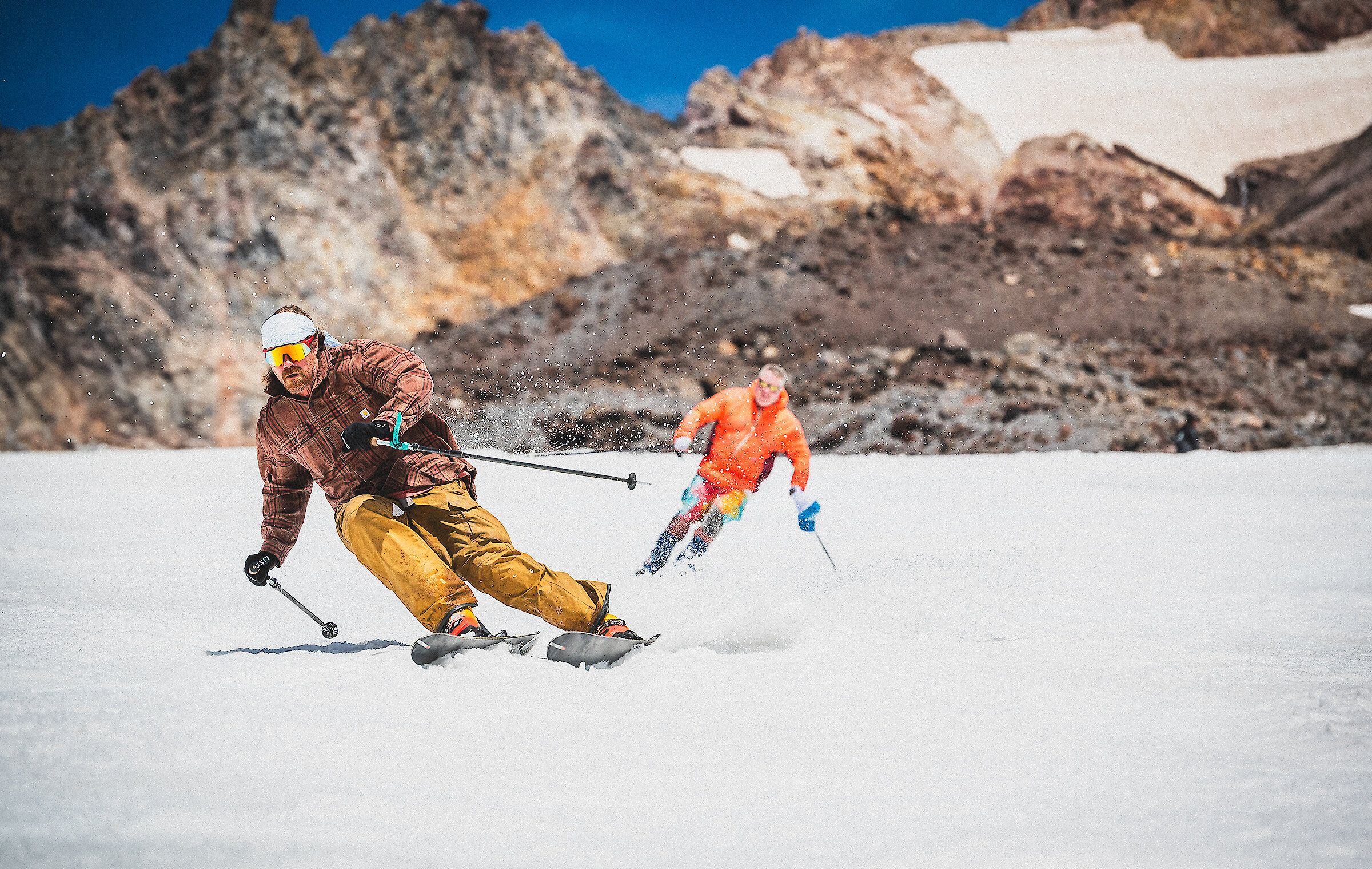 Two men skiing down Palmer in the summer