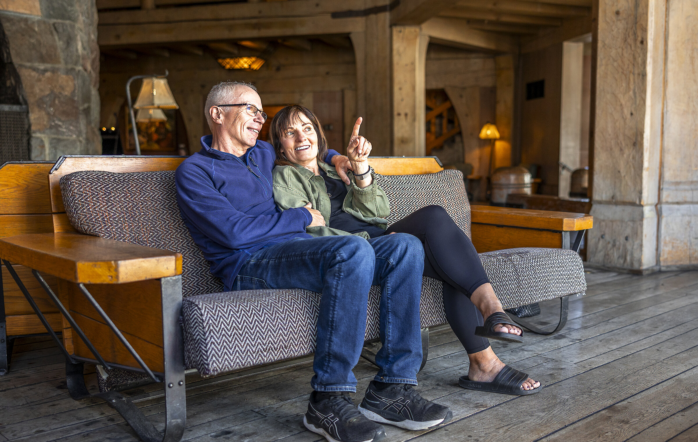 Couple enjoying the views from a sofa in the headhouse at Timberline