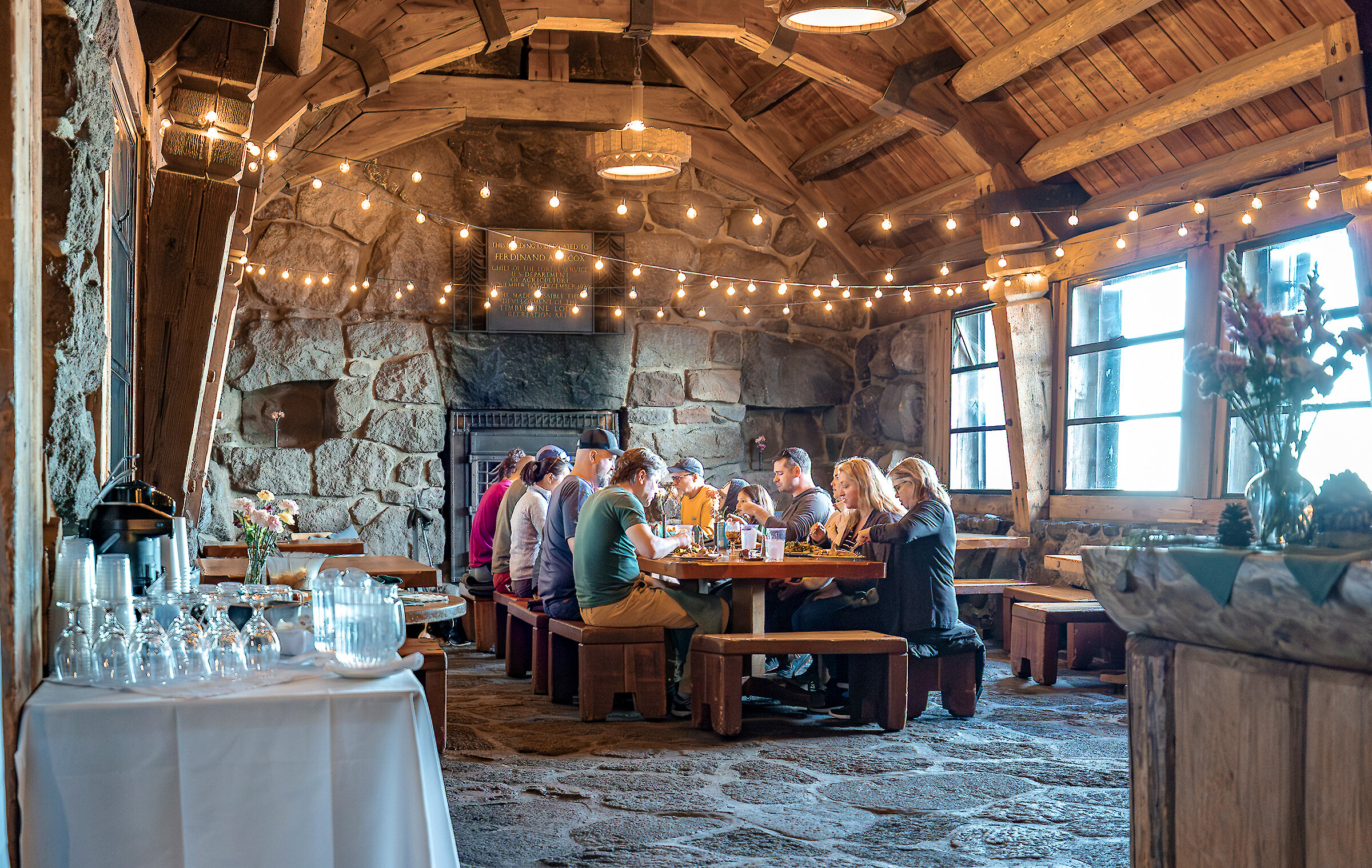 Guests gathered around the dinner table at Silcox Hut
