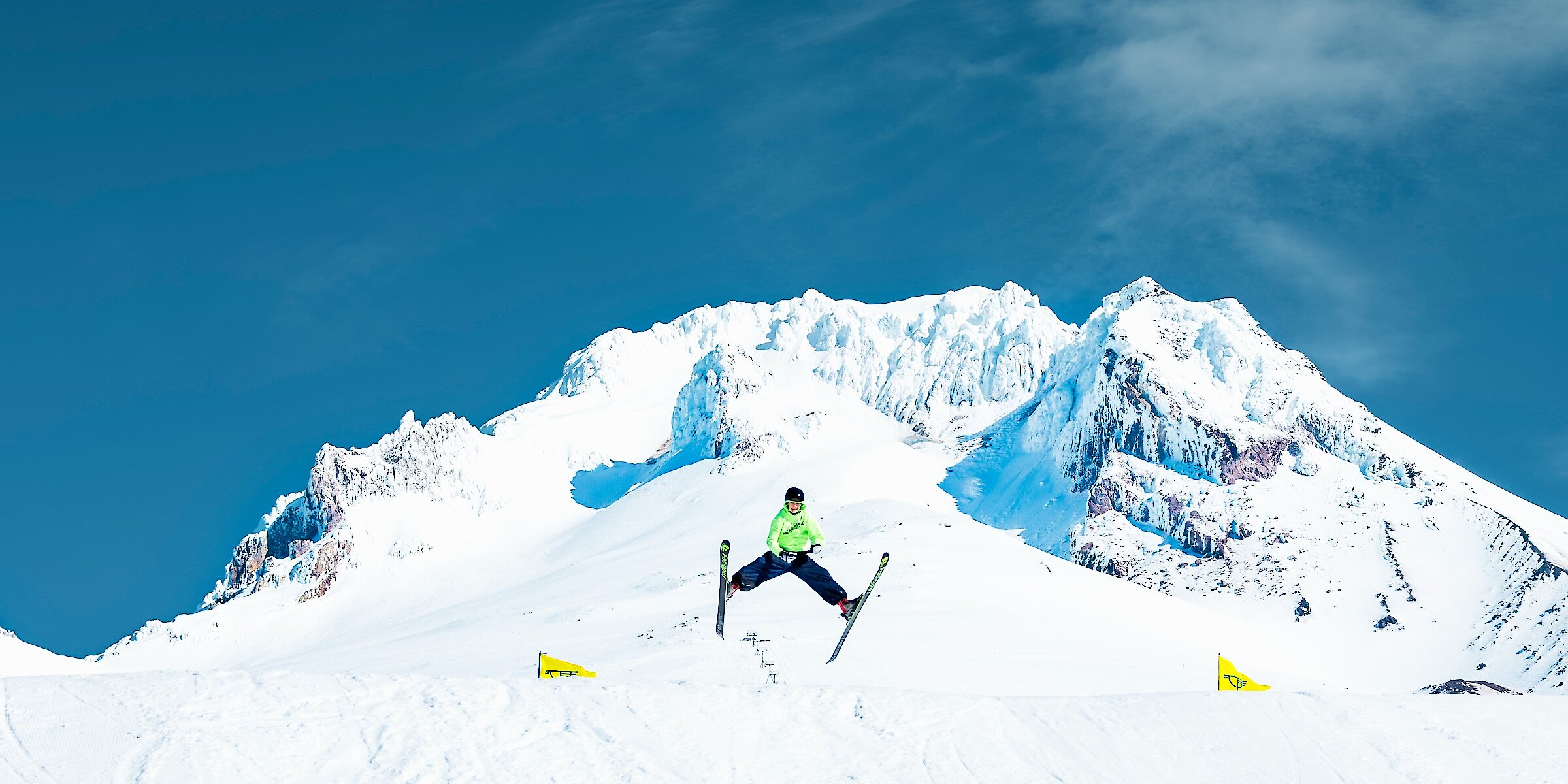 Skier spread-eagle jumping on Mt. Hood at Timberline