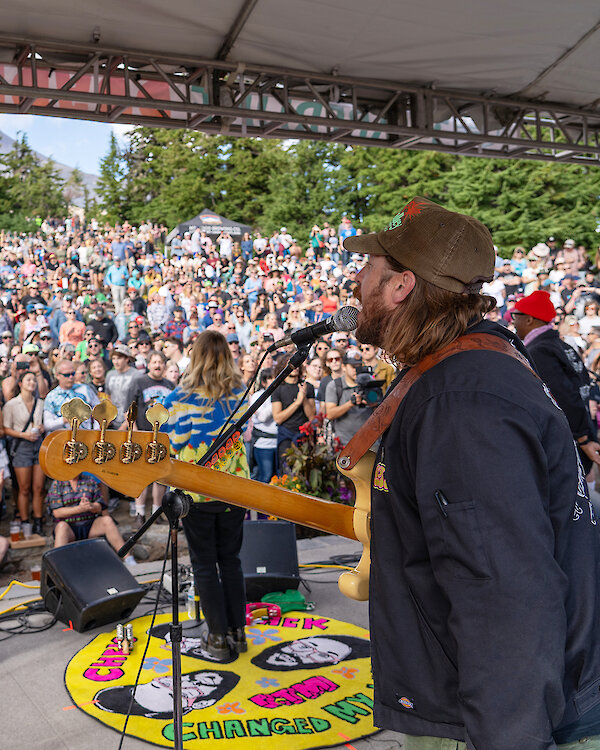 Timberline Daydream crowd enjoying a live outdoor concert at Mt. Hood with mountain views, summer festival atmosphere, and musicians performing on stage at Timberline Lodge.