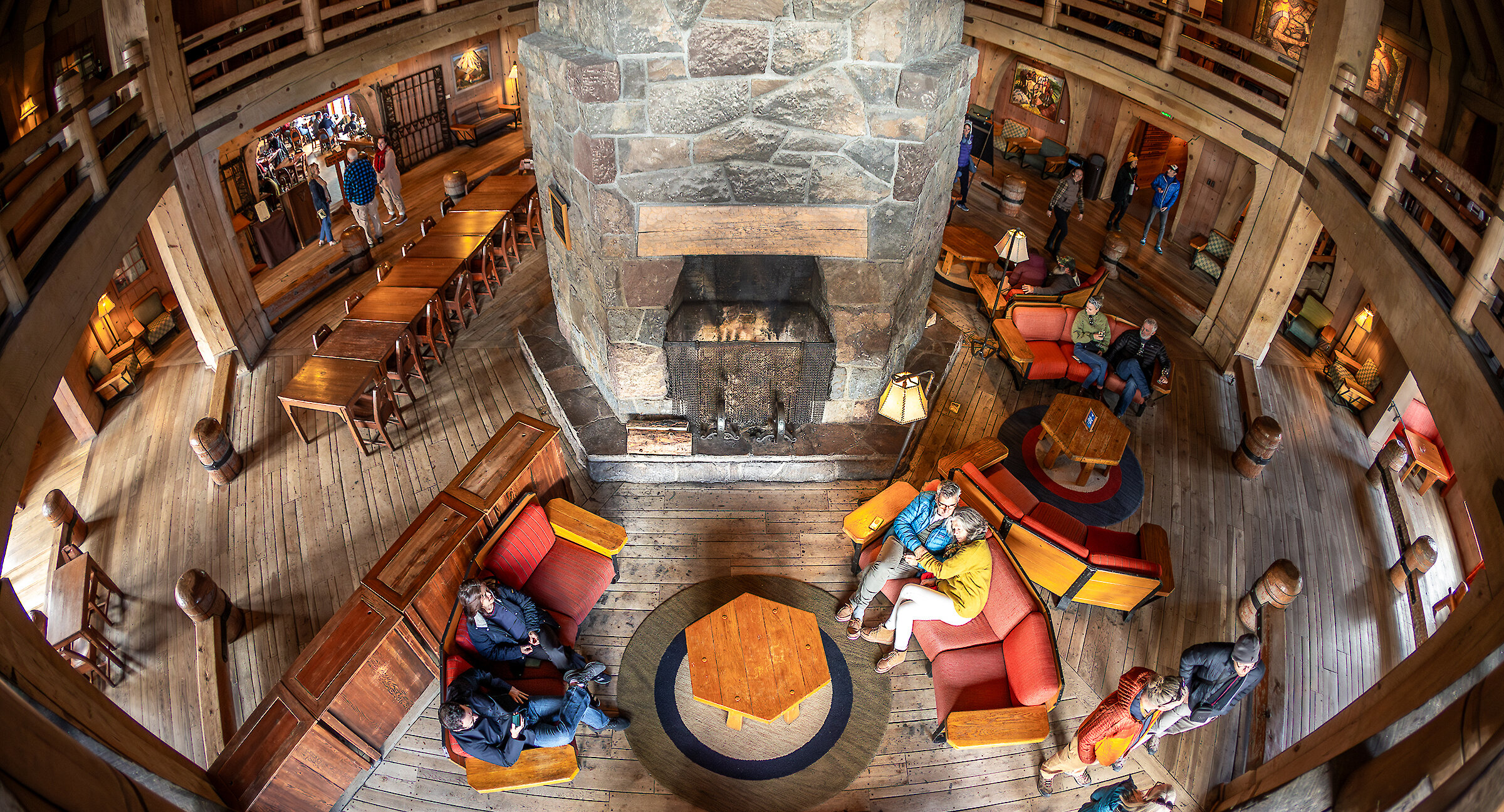 Guests gathered around Timberline's Main Headhouse grand fireplace