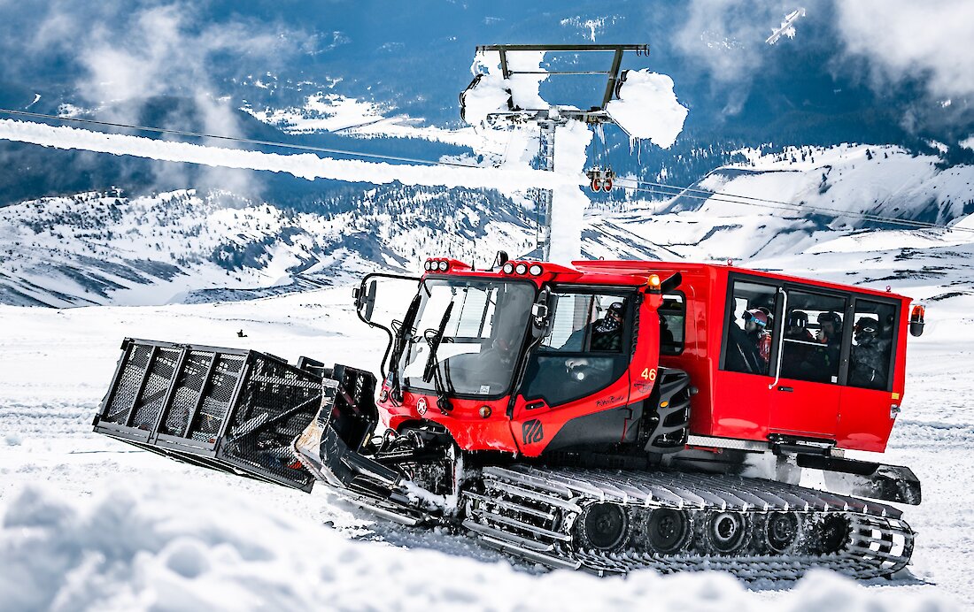 A red Timberline snowcat facilitating snowcat skiing on Palmer