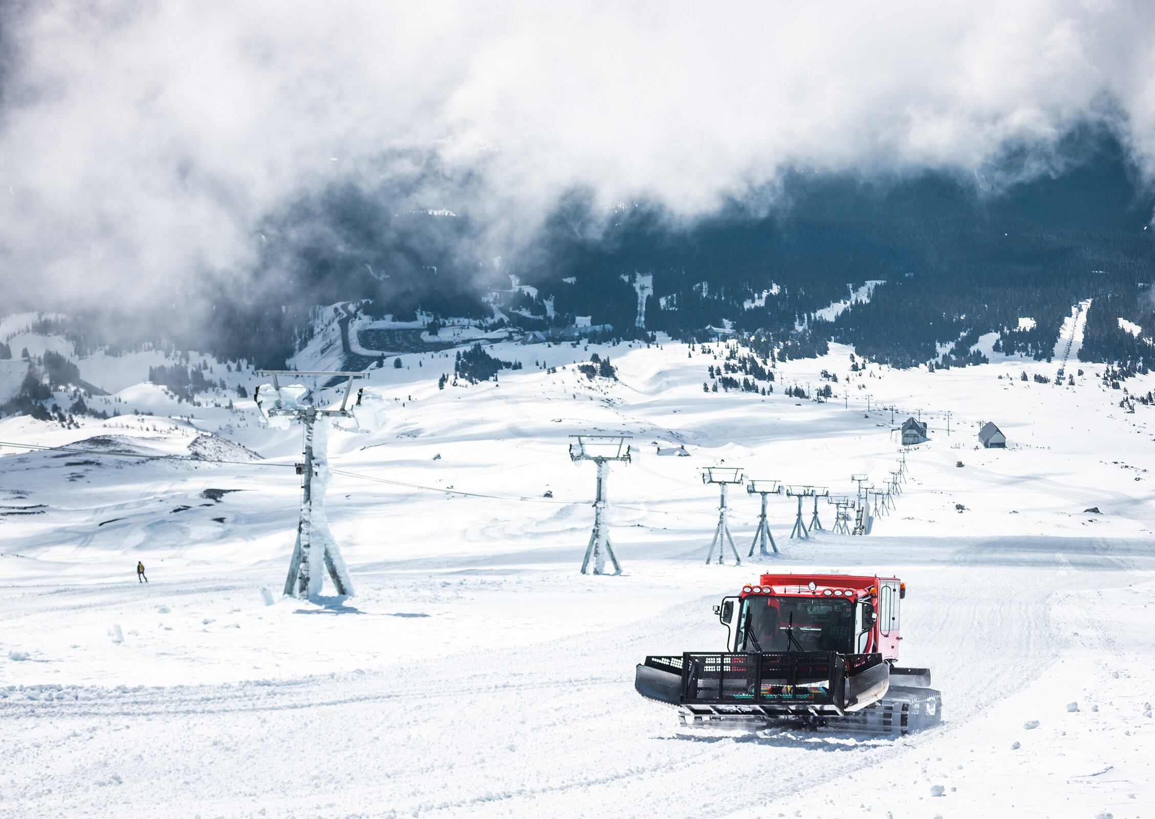 Skiers hitting rails in the Timberline terrain park