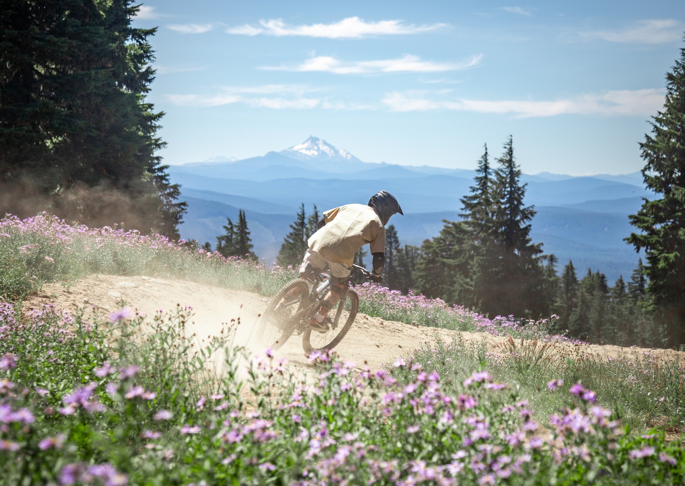 Mountain biker on a Timberline Bike Park Trail overlooking the Cascades