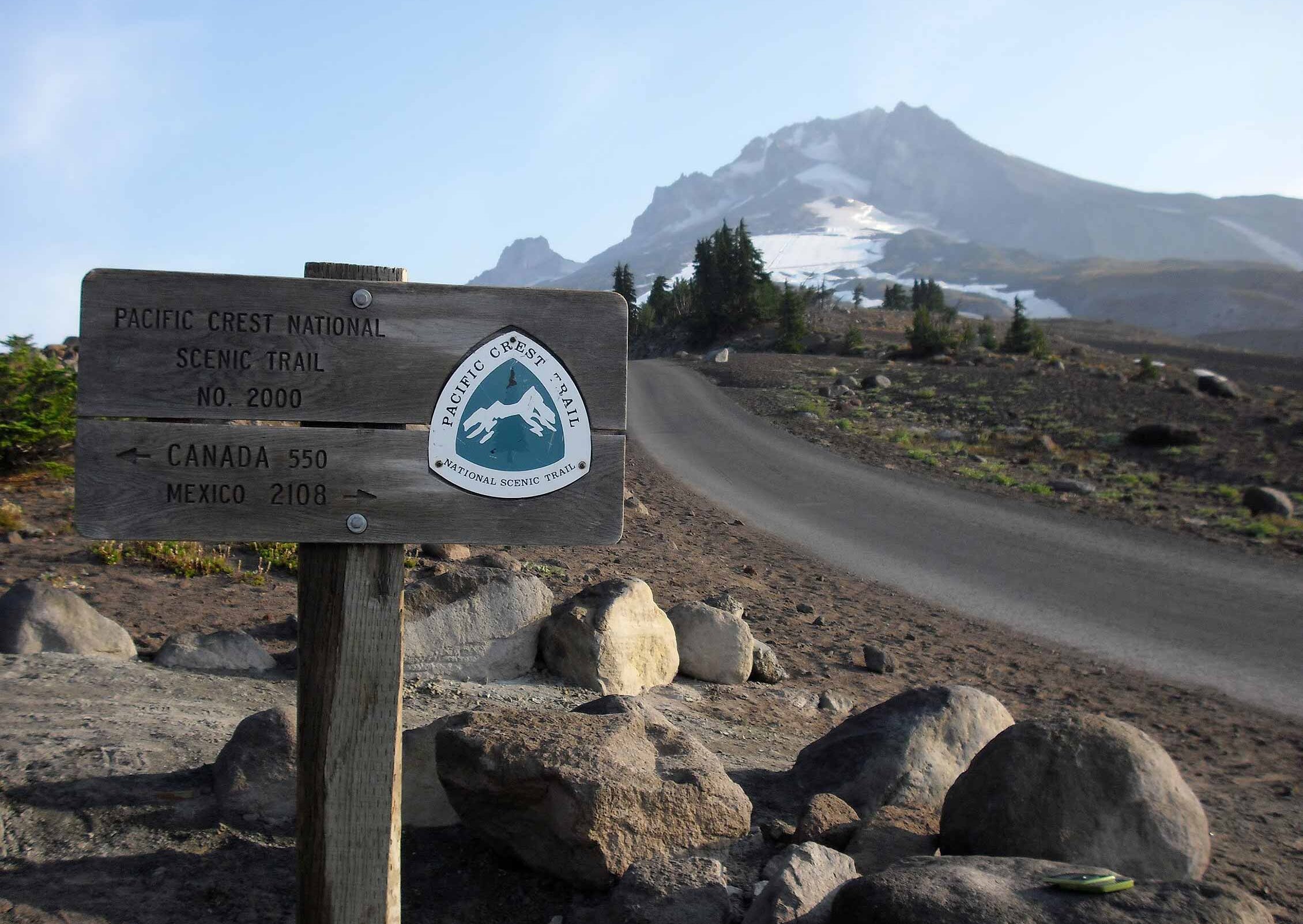 Pacific Crest Trail wooden sign posted on the trail on Mt. Hood