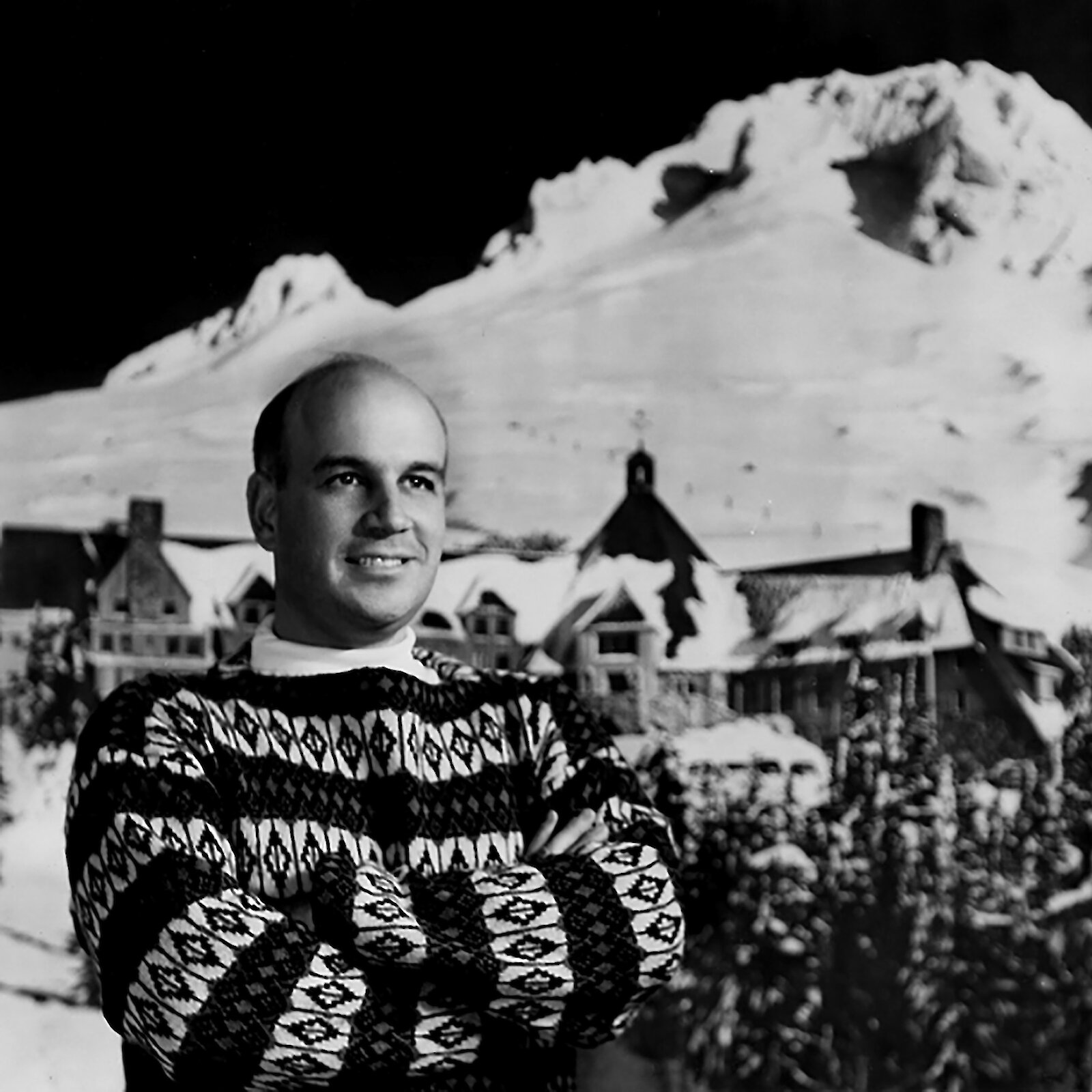 Vintage photo of Richard L. Kohnstamm, former president of R.L.K. and Company, standing in front of Timberline Lodge, which he save from ruin.