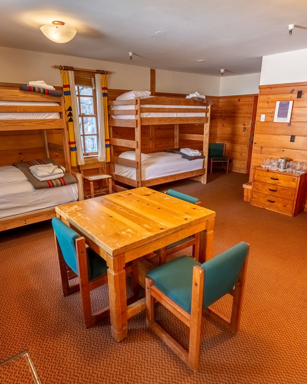 The Mary Gautreaux Room, the largest chalet at Timberline Lodge featuring a seating area and bunk beds