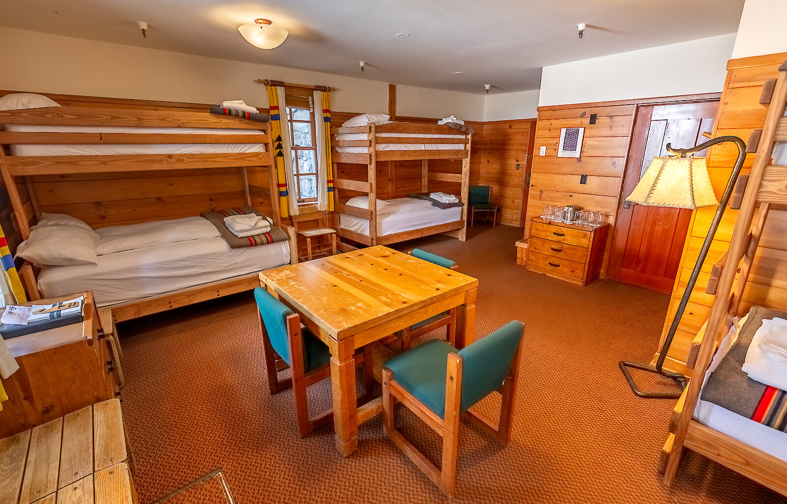 The Mary Gautreaux Room, the largest chalet at Timberline Lodge featuring a seating area and bunk beds