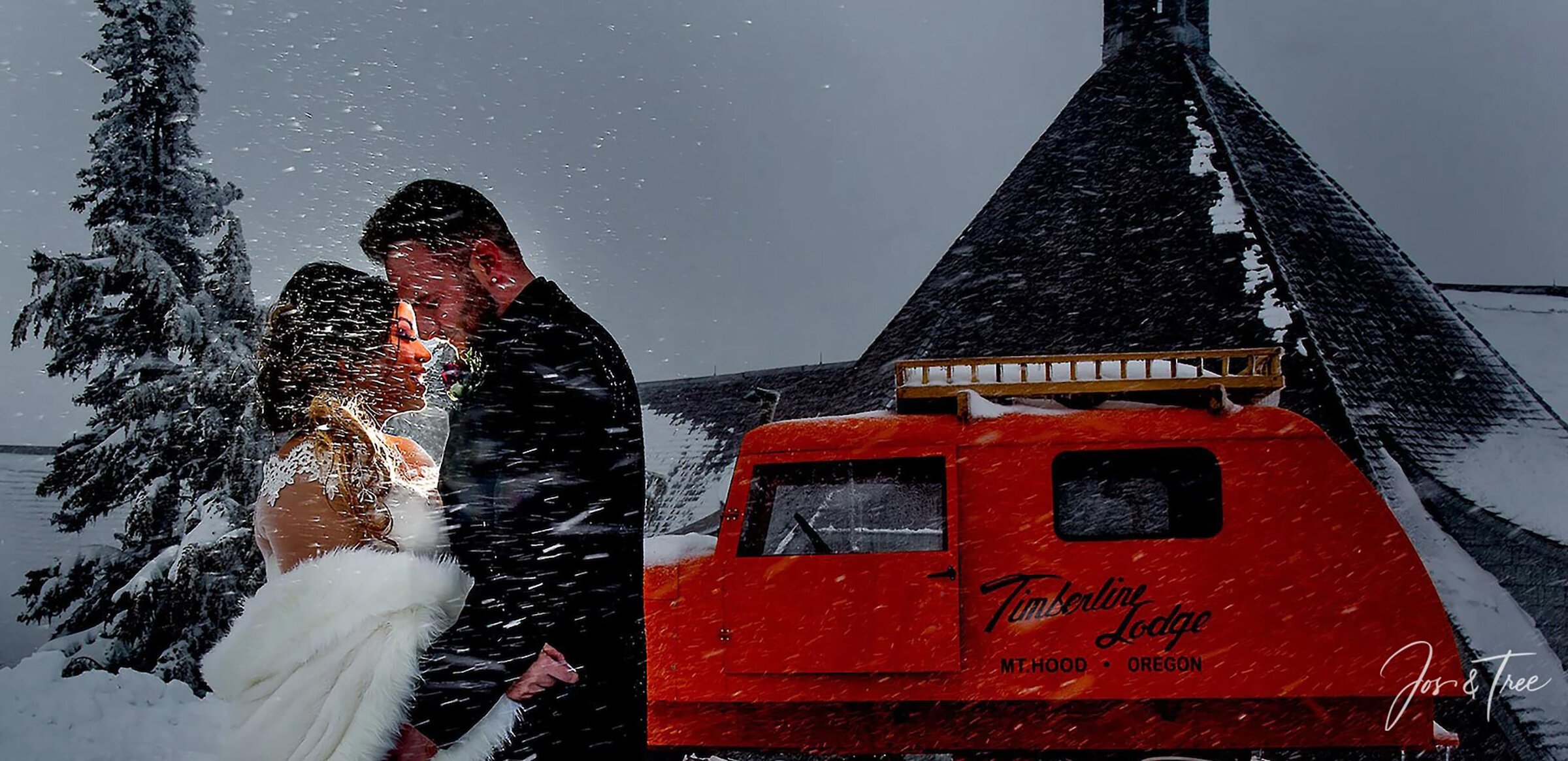 Wedding couple posing in the snow behind Timberline Lodge in front of a vintage orange Tucker Sno-Cat with the Timberline logo on it