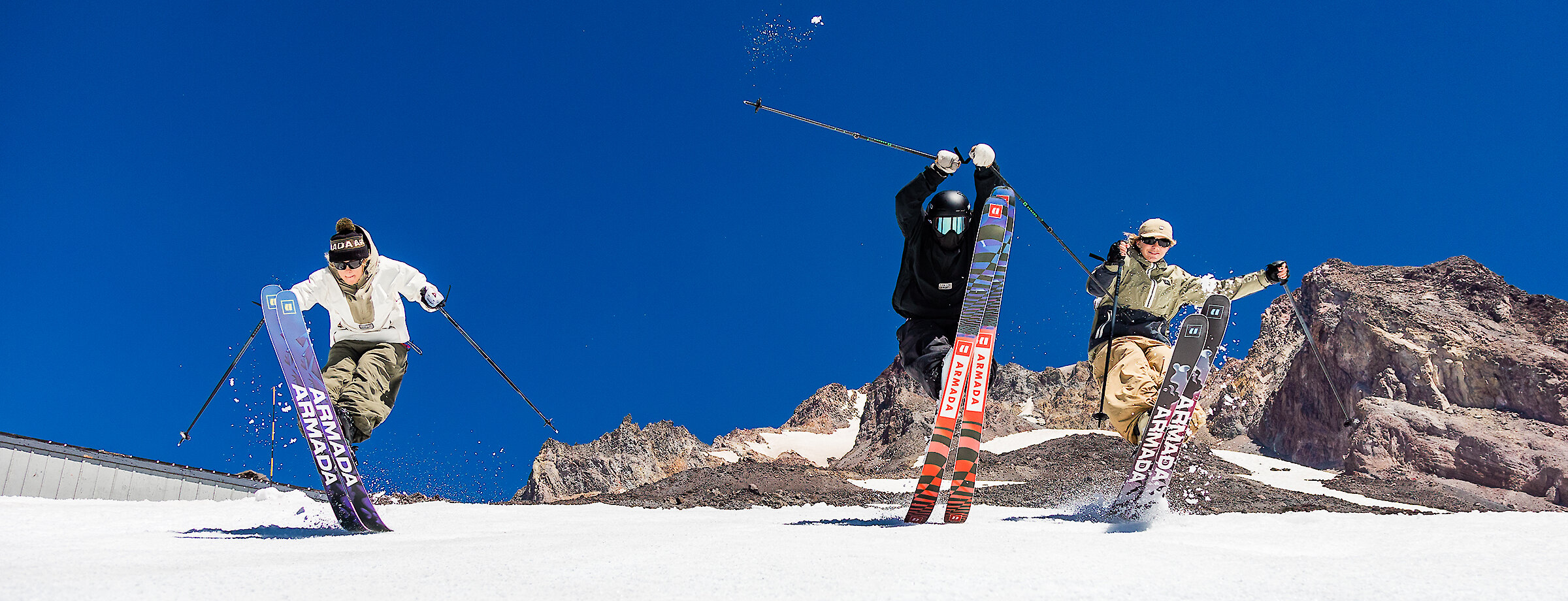 Three skiers tips up on Palmer at Timberline in the summer