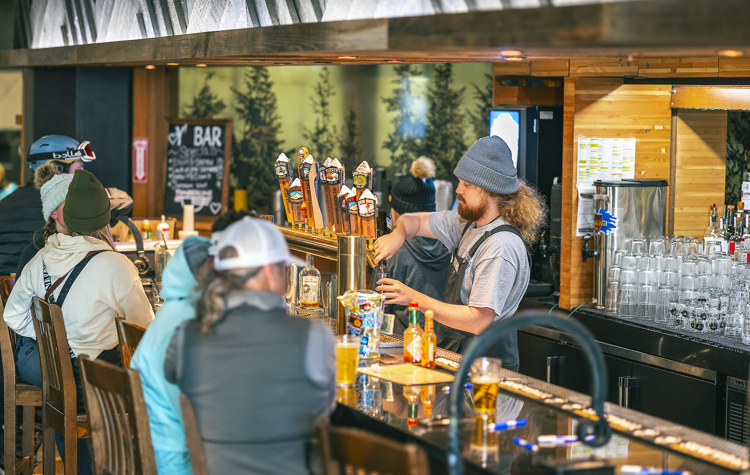 Skiers and snowboarders enjoying refreshments at the Y'Bar at Timberline