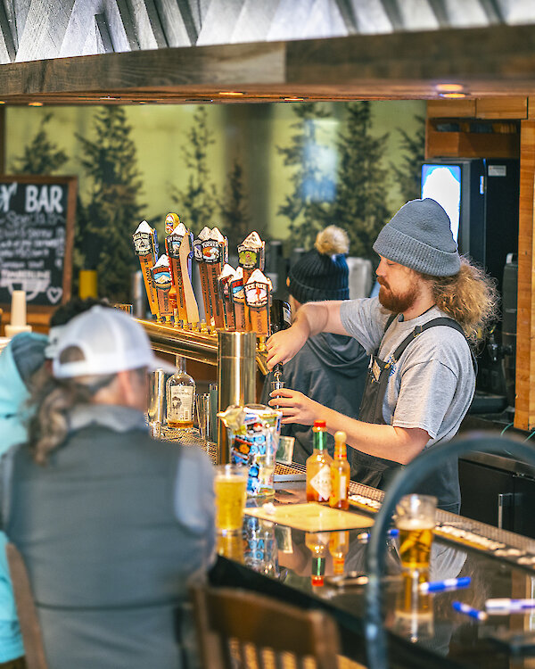 Skiers and snowboarders enjoying refreshments at the Y'Bar at Timberline