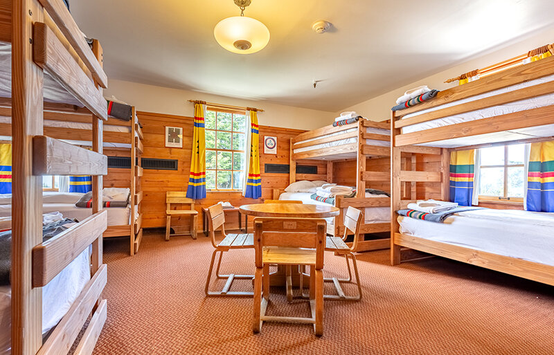 The Mary Gautreaux Room, the largest chalet at Timberline Lodge featuring a seating area and bunk beds