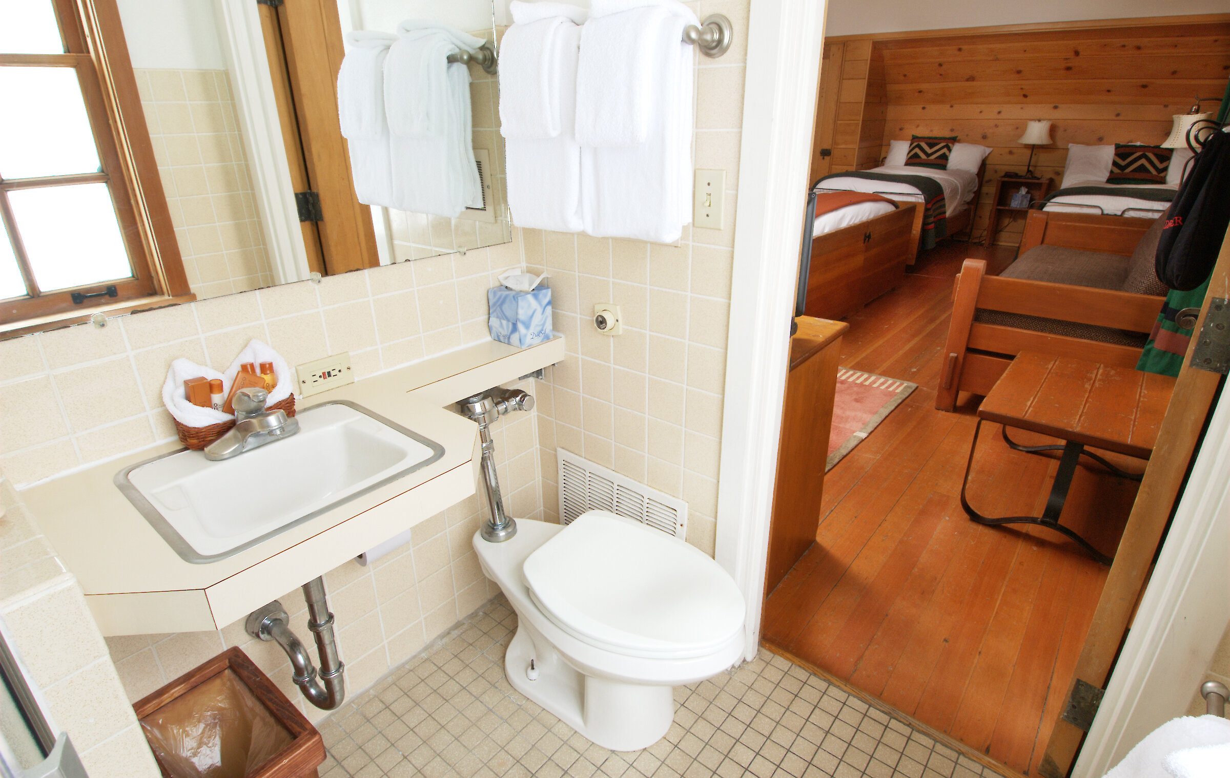 A Timberline Corner Room bathroom pictured looking into the bedroom