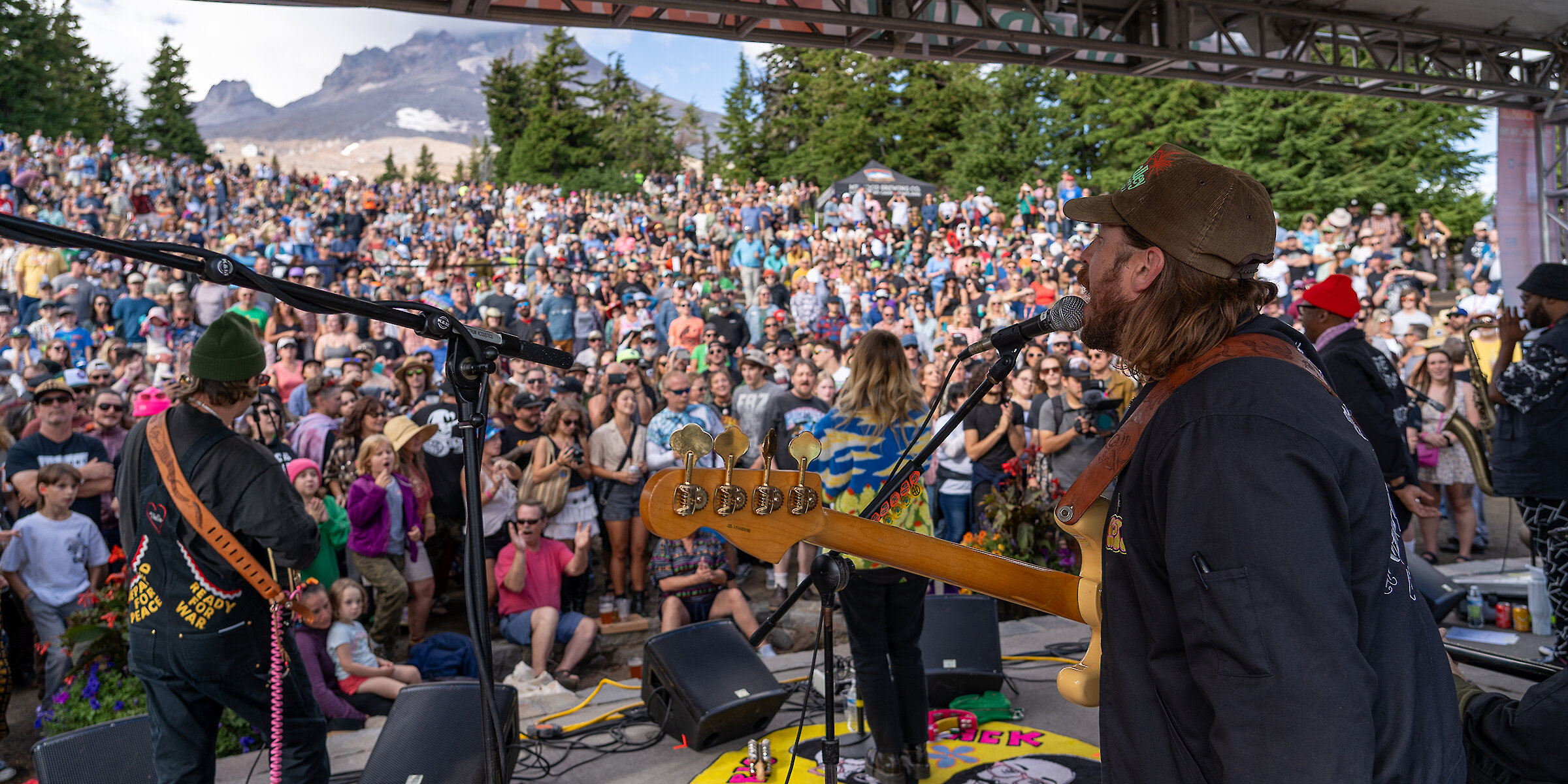 Band performing on stage at Timberline Daydream Music Festival with a large crowd and Mt. Hood in the background.